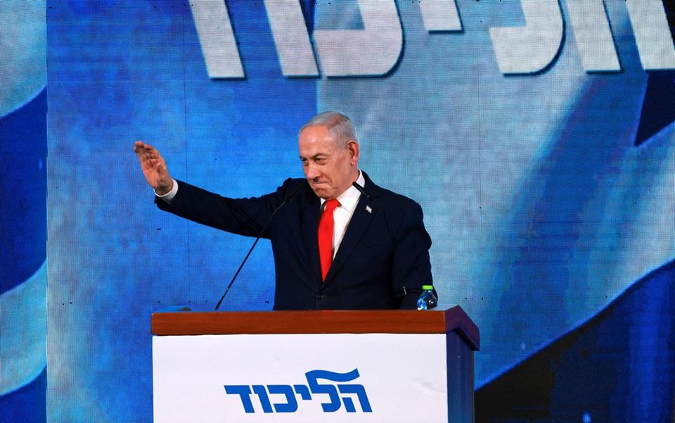 Benjamin Netanyahu gestures at Likud headquarters after the election.