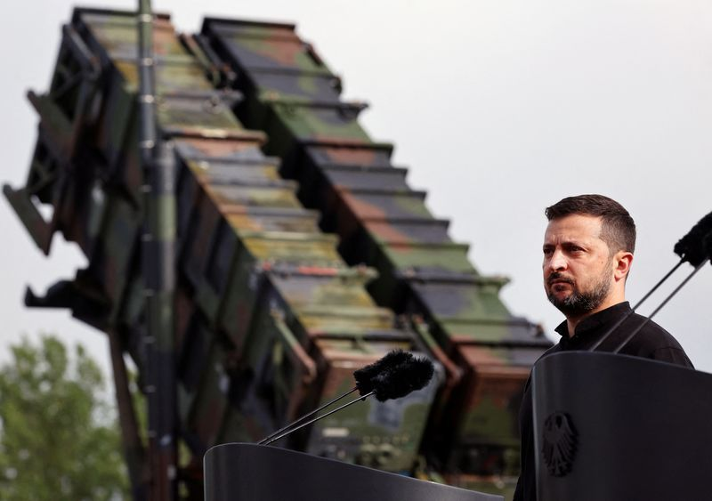 Zelenskiy stands near a Patriot launcher during a visit to a German training area.